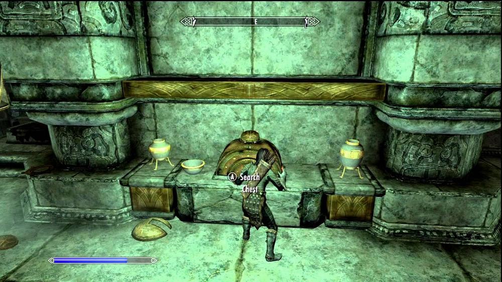 A screenshot from the video game Skyrim, showing a chest in a dark room.