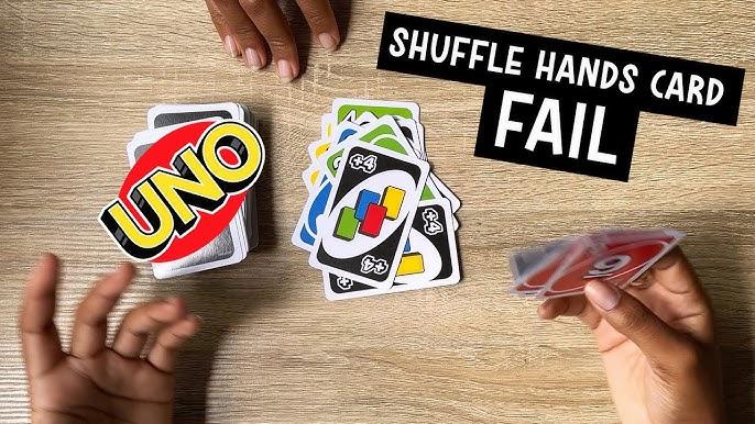 A person playing the card game Uno is attempting to play a shuffle hands card, but has failed as they do not have a matching color or number card in their hand.